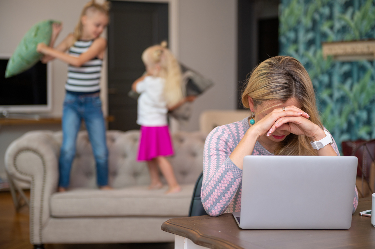 Exhausted Mother Trying to Work from Home